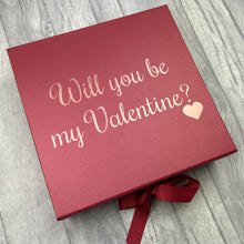 Load image into Gallery viewer, Red large square gift box with ribbon tie. The box features rose gold love heart design with script lettering saying Will you be my Valentine?
