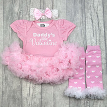 Load image into Gallery viewer, Baby girls pink tutu romper with bow headband above and leg warmers below. The tutu romper features white glitter lettering saying Daddy's Little Valentine.