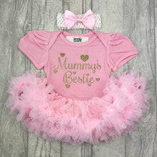 Load image into Gallery viewer, Baby girls short sleeve pink tutu romper with bow headband above. The tutu romper features gold glitter love hearts design with script style text saying Mummy's Bestie.