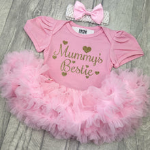 Load image into Gallery viewer, Baby girls short sleeve pink tutu romper with bow headband above. The tutu romper features gold glitter love hearts design with script style text saying Mummy's Bestie.