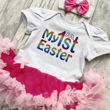 Load image into Gallery viewer, Baby girls short sleeve white and pink tutu romper with bow headband above. The tutu romper features a rainbow coloured My 1st Easter design.
