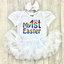 Load image into Gallery viewer, Baby girls short sleeve white tutu romper with bow headband above. The tutu romper features a rainbow coloured My 1st Easter design.