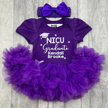 Load image into Gallery viewer, Baby girls short sleeve dark purple tutu romper with bow headband above. The tutu romper features white glitter hat and stars design with lettering saying NICU Graduate, Personalised Name