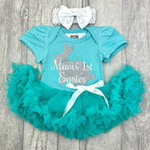 Load image into Gallery viewer, Baby girls short sleeve green tutu romper with bow headband above. The tutu romper features silver glitter bunny design with white lettering over the top saying Personalised Name's 1st Easter.