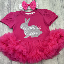 Load image into Gallery viewer, Baby girls short sleeve dark pink tutu romper with bow headband above. The tutu romper features silver glitter bunny design with white lettering over the top saying Personalised Name's 1st Easter.