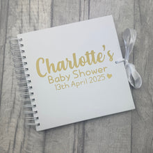 Load image into Gallery viewer, Spiral bind white 8inch scrapbook with white ribbon tied in a bow. The scrapbook cover features gold lettering design saying Personalised Name Baby Shower Personalised Date.