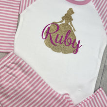Load image into Gallery viewer, Pink and White Striped Pyjama Set. The top features a gold glitter Belle Princess design and pink glitter personalised name