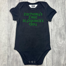Load image into Gallery viewer, Babies black romper bodysuit, featuring green glitter lettering saying Personalised name's First St Patrick's Day
