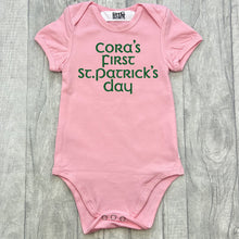 Load image into Gallery viewer, Babies pink romper bodysuit, featuring green glitter lettering saying Personalised name's First St Patrick's Day