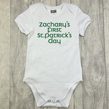 Load image into Gallery viewer, Babies white romper bodysuit, featuring green glitter lettering saying Personalised name's First St Patrick's Day
