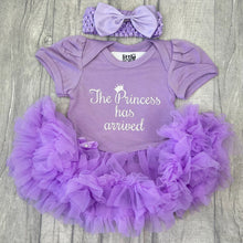 Load image into Gallery viewer, Baby girls short sleeve light purple tutu romper with bow headband. The tutu romper features white glitter script lettering saying The Princess has arrived.