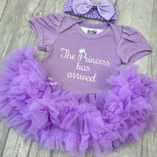 Load image into Gallery viewer, Baby girls short sleeve lilac tutu romper with bow headband. The tutu romper features white glitter script lettering saying The Princess has arrived.