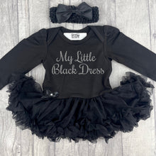 Load image into Gallery viewer, Baby Girls long sleeve black tutu romper with matching bow headband above. The tutu romper features silver glitter script text saying My Little Black Dress