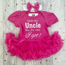 Load image into Gallery viewer, Baby girls short sleeve dark pink tutu romper with matching bow headband above. The tutu romper features white glitter lettering saying Ain't no Uncle like the one I Got!