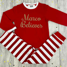 Load image into Gallery viewer, Personalised Girls & Boys 'Believes' Christmas Pyjamas, Red And White Or Red And Green Stripe