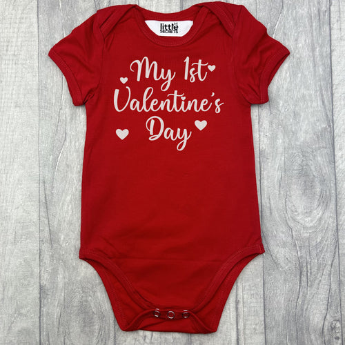 Babies short sleeve red romper bodysuit featuring white glitter love hearts design and lettering saying My 1st Valentine's Day