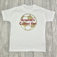 Load image into Gallery viewer, White T-shirt featuring gold football design with red text over the top saying Arsenal&#39;s Cutest Fan
