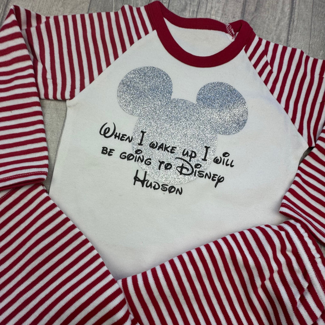 Red and White striped Pyjama Set. The top features silver glitter Mickey Mouse design with Black Disney lettering saying When I wake up I will be going to Disney Personalised Name