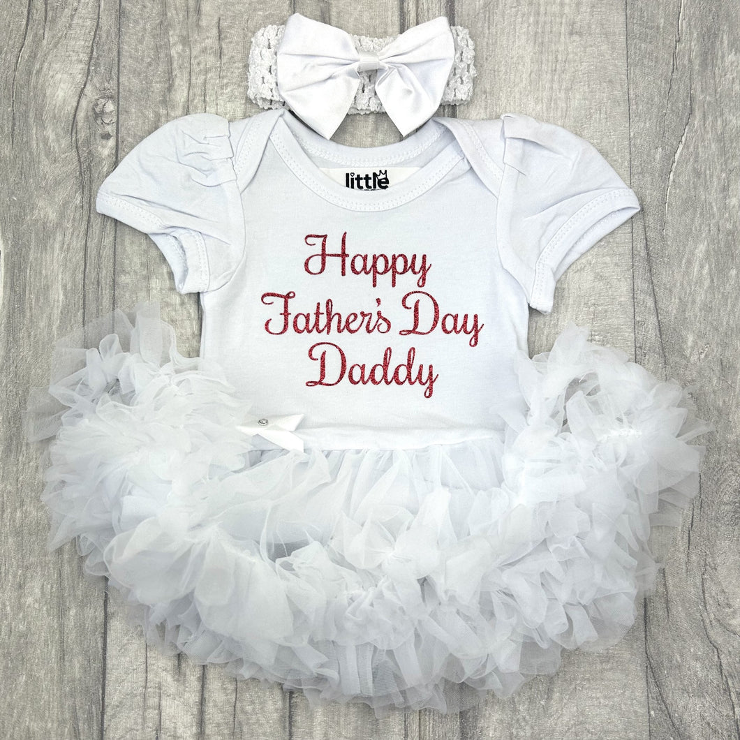 Baby girls short sleeve white tutu romper with bow headband above. The tutu romper features red glitter script text saying Happy Father's Day Daddy.