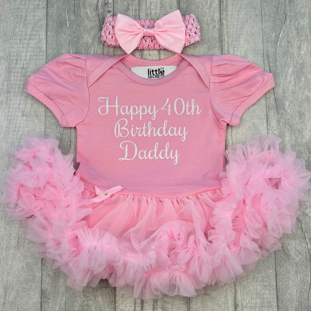 Baby Girls Light Pink Tutu Romper with Bow Headband above. The tutu romper features white glitter script lettering saying Happy 40th Birthday Daddy.