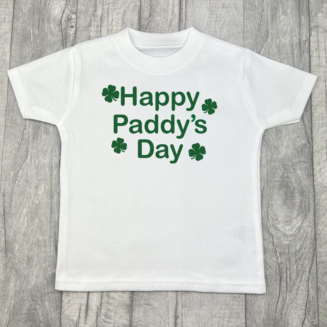 Children's white t-shirt, features green glitter four leaf clover design with lettering in the middle saying Happy Paddy's Day.