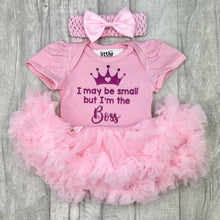 Load image into Gallery viewer, Baby girls light pink short sleeve tutu romper with matching bow headband above, the tutu romper features dark pink glitter princess crown design with lettering underneath saying I may be small but I&#39;m the Boss
