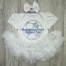 Load image into Gallery viewer, Baby outfit with &#39;Manchester City&#39;s Cutest Fan&#39; text on a white shirt with ruffled skirt and headband.
