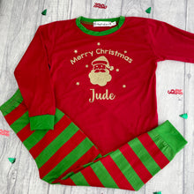 Load image into Gallery viewer, Red and Green Striped Pyjama Set. The top features gold glitter Santa design with lettering Merry Christmas, Name.
