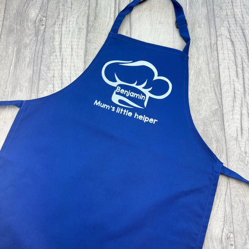 Blue Kids Apron featuring a White Glitter Chef Hat design with Personalised Name in the middle and lettering saying Mum's little helper underneath