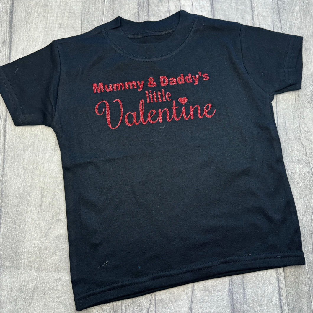 Black t-shirt featuring red glitter lettering saying 'Mummy & Daddy's Little Valentine'.