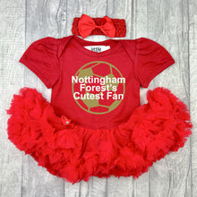 Load image into Gallery viewer, Baby girls short sleeve red tutu romper with bow headband above. The tutu romper features a gold glitter football design with white lettering central over the top saying Nottingham Forest&#39;s Cutest Fan.
