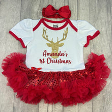 Load image into Gallery viewer, Baby girls white with red sequin tutu romper and matching bow headband above. The tutu romper features gold glitter reindeer design with red glitter lettering underneath saying Personalised Names 1st Christmas.
