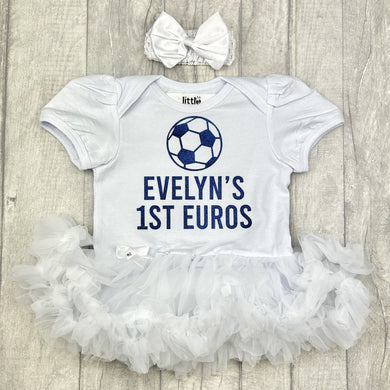 Baby Girls White short sleeve Tutu Romper with bow headband above. The tutu romper features Navy Blue football design and text underneath 'Name' 1st Euros