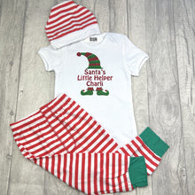 Load image into Gallery viewer, White bodysuit romper with matching red and white striped pants and hat set. The bodysuit features a elf design with lettering saying Santa&#39;s Little Helper.
