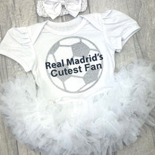 Load image into Gallery viewer, Baby outfit with &#39;Real Madrid&#39;s Cutest Fan&#39; text and football design on a white tutu romper. Matching headband above.
