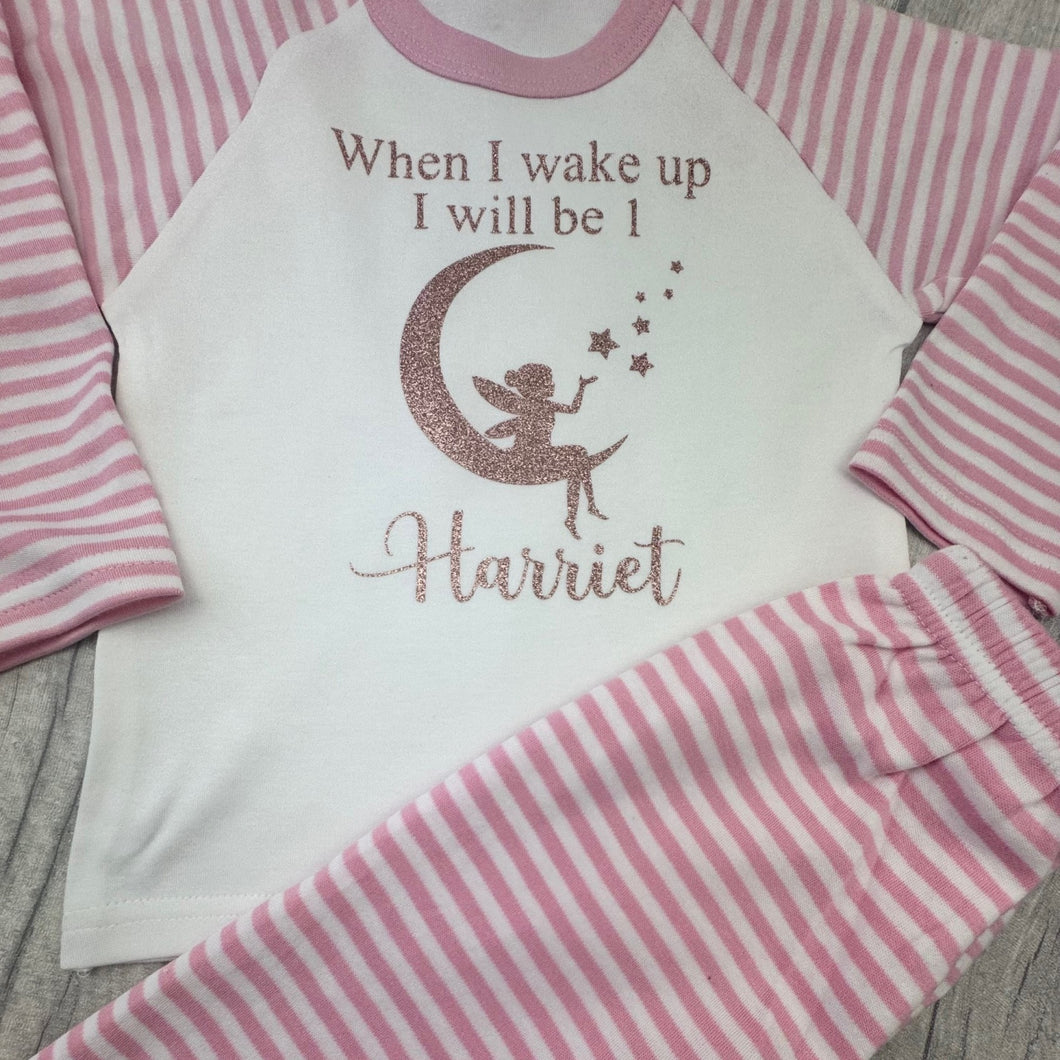 Pink and white striped pajama set with 'When I wake up I will be 1 Harriet' text on a white shirt.