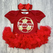 Load image into Gallery viewer, Red tutu romper with bow headband, featuring a gold football design and white text over the top saying &#39;Wrexham&#39;s Cutest Fan&#39;.

