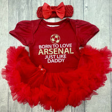 Load image into Gallery viewer, Baby Girls Red Tutu Romper with Bow Headband above. The tutu romper features football design with white and gold glitter lettering saying Born to love Arsenal just like daddy.
