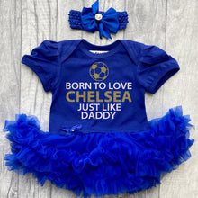 Load image into Gallery viewer, Baby Girls Royal Blue Tutu Romper with Bow Headband above. The tutu romper features football design with white and gold glitter lettering saying Born to love Chelsea just like daddy.
