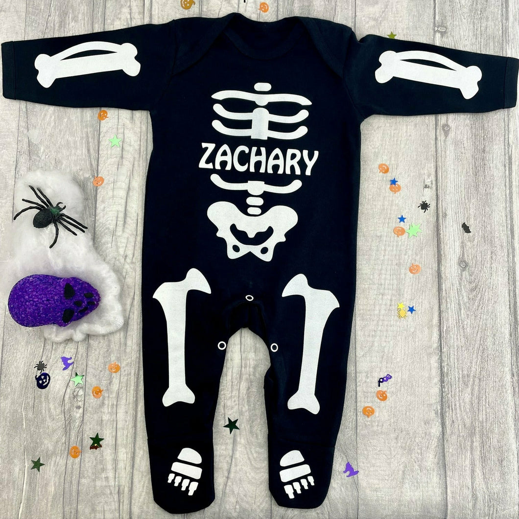 Personalised Baby Boys or Girls Full-Body Black Sleepsuit, White Glitter Halloween Skeleton