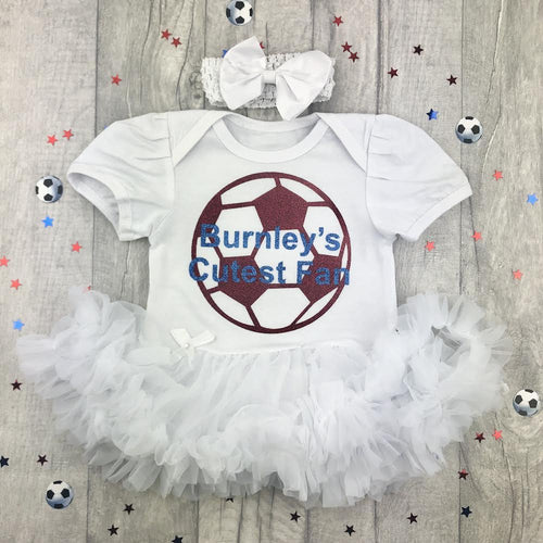 Baby Girls Burnley's Cutest Fan, The Clarets, White Tutu Romper Dress, Featuring A Maroon Football Design and Light Blue Text. Including a matching White headband with Clip on bow 