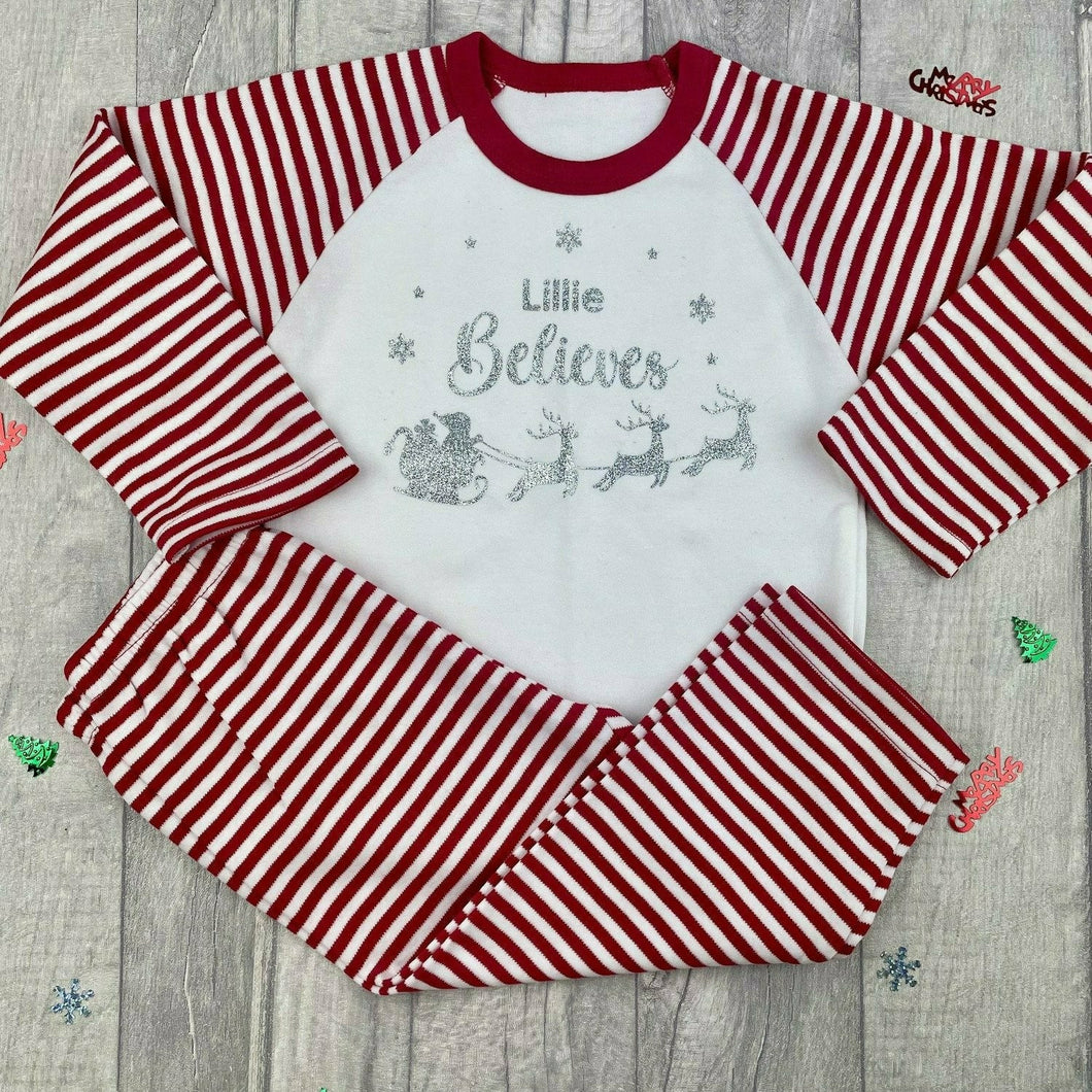 Personalised Children's Christmas Pyjamas, Santa & Sleigh,'*Name* Believes' Red & White Stripe, Boys & Girls X-Mas PJ's