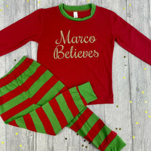 Load image into Gallery viewer, Personalised Girls &amp; Boys &#39;Believes&#39; Christmas Pyjamas, Red And White Or Red And Green Stripe
